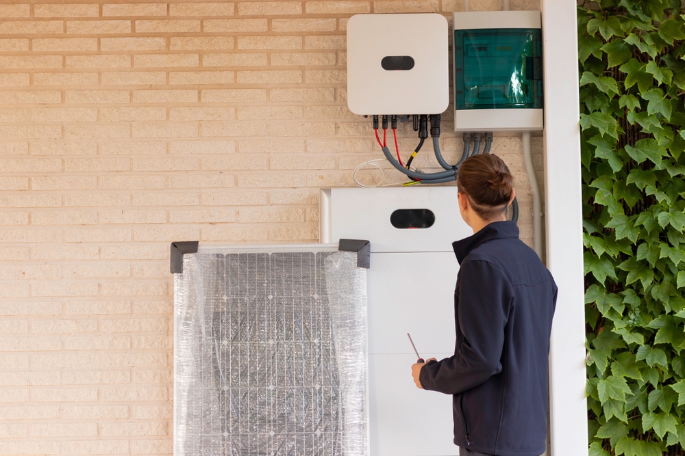 Back,View,Of,Unrecognizable,Young,Man,Technician,Installing,A,Solar